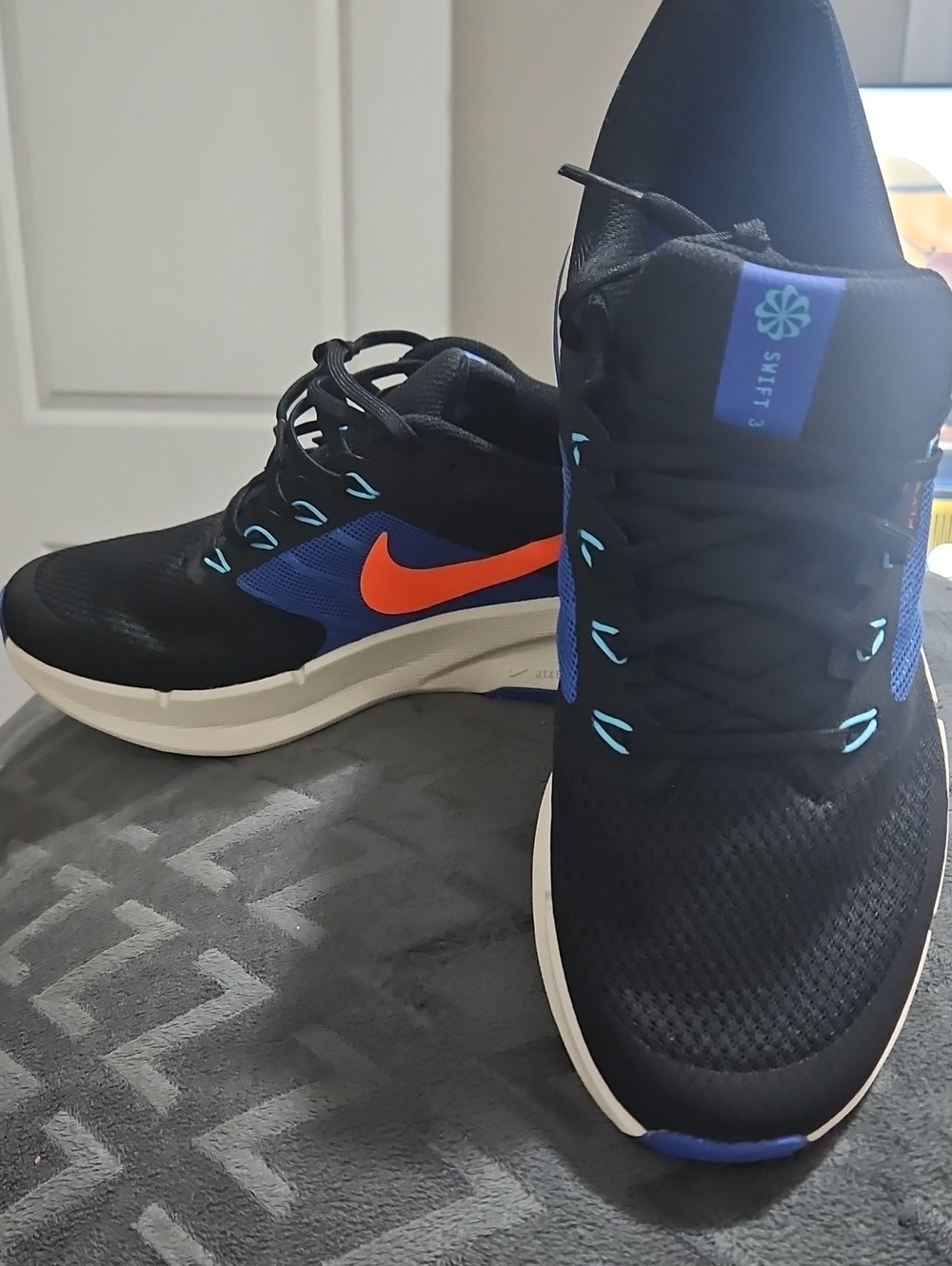 Nike Men’s Black & Blue Running Sneakers with Orange Swoosh